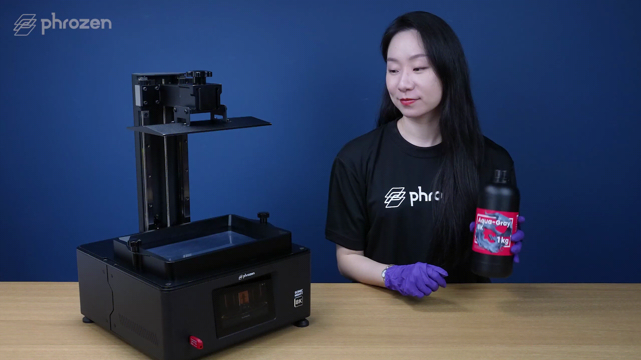 Shaking and pouring Aqua-Gray 8K resin into the resin vat of Mighty 8K LCD 3D Printer