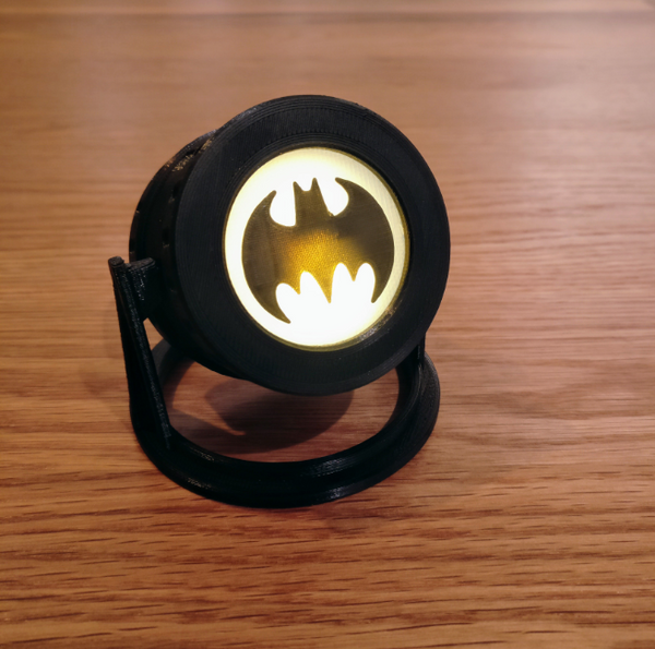 Cool 3D printables Batman signal tea light holder that casts the iconic symbol when lit.