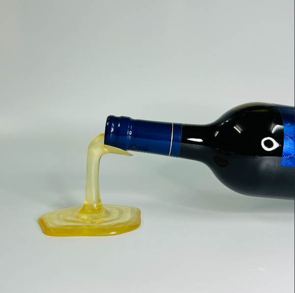 Cool 3D printables wine holder designed to mimic a bottle spilling wine, fun for decor.