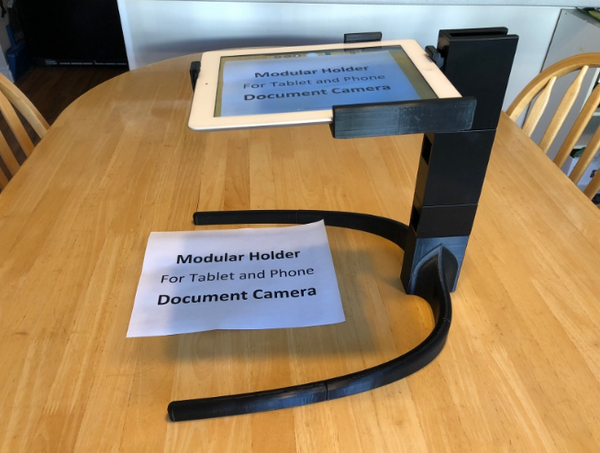Cool 3D print of a modular stand for phones or tablets, transforming them into document cameras.