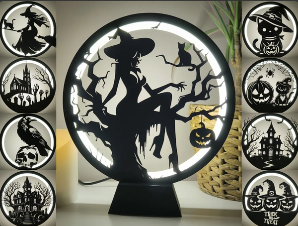 A circular 3D-printed lamp with Halloween-themed silhouette panels, including a witch, haunted house, and pumpkins, illuminated with LED lights.