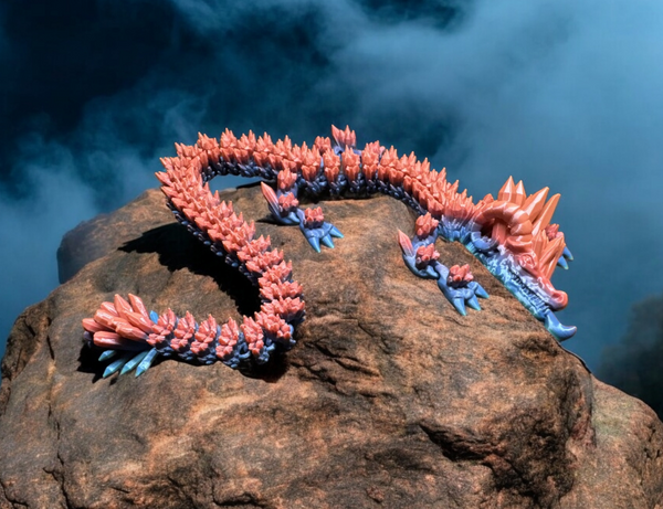 A 3D-printed Amethyst Cluster Dragon in vibrant pink and blue colors, curled on a rock, with a detailed crystal-like texture.