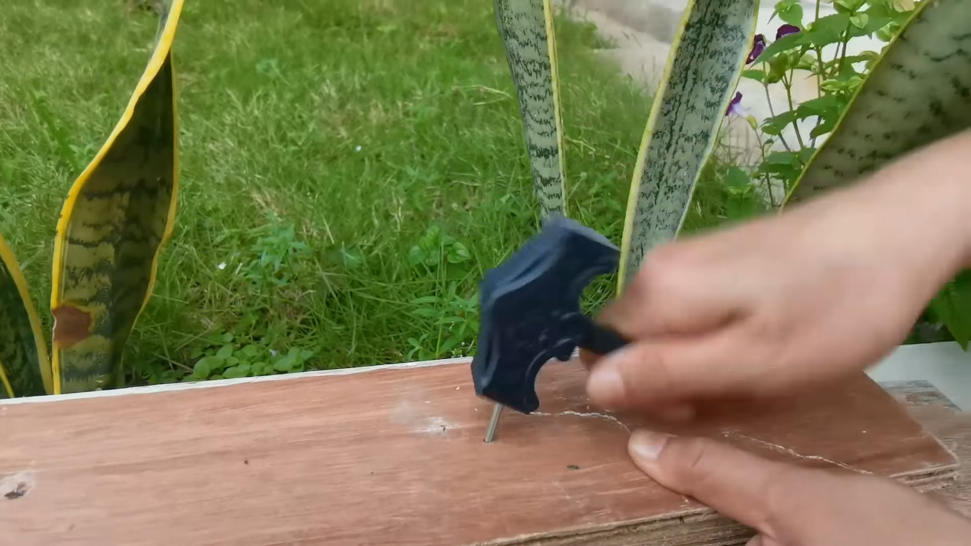 Strong resin impact test hammering metal nail with printed hammer