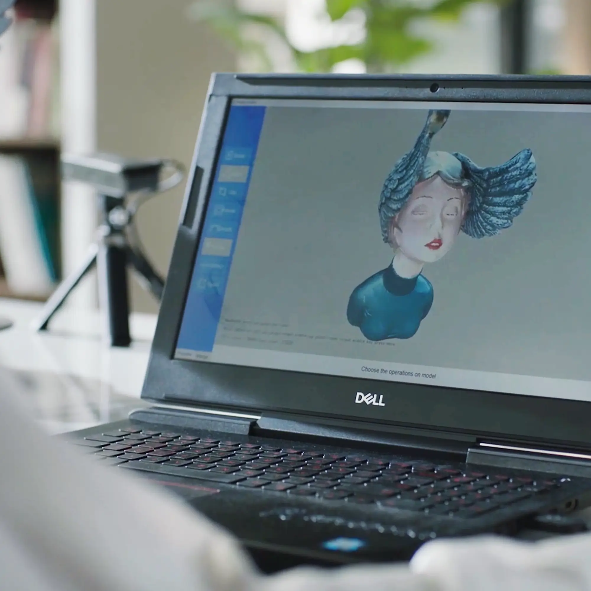 3D scanned model displayed on a laptop screen during the model refinement step of the 3D scanning to printing process.
