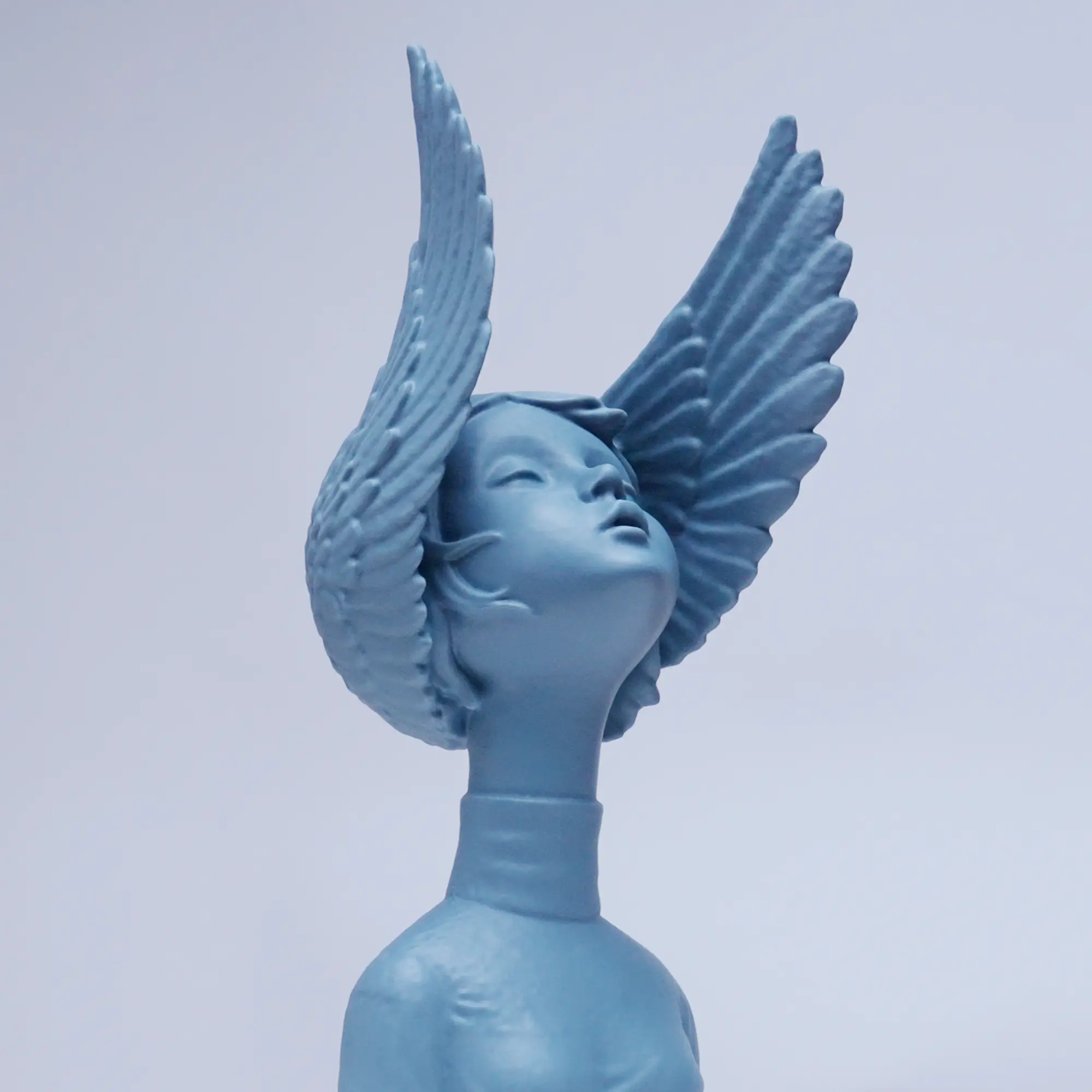 Finished 3D printed model of a winged figure from the final step of the 3D scanning to printing process.
