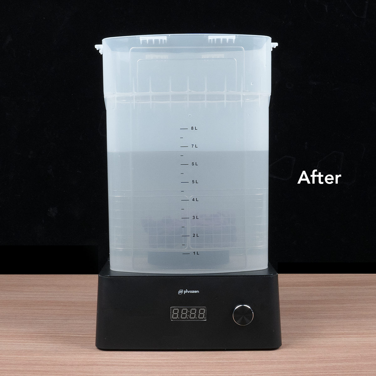 Used alcohol after filtration in a large container, showing clearer liquid with reduced resin residue.