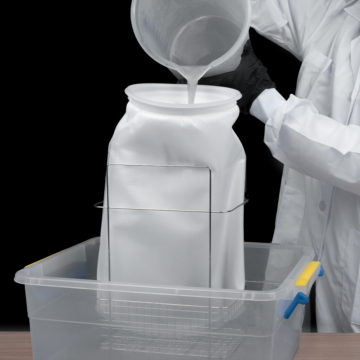 Used alcohol being poured into the Phrozen Alcohol Filter Bag for direct filtration, showing a faster way to reuse alcohol.