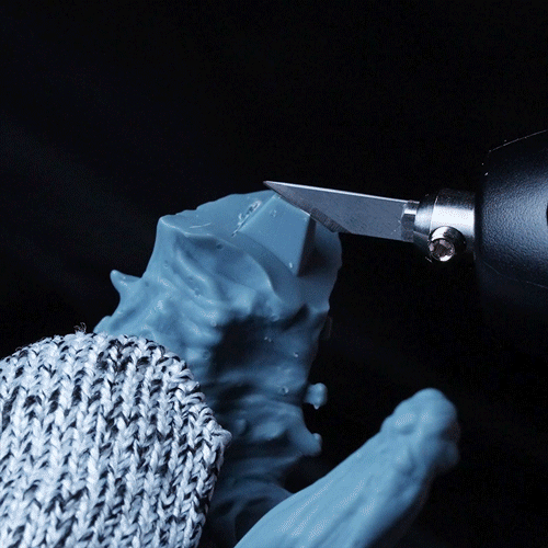 Hand trimming a model with the Phrozen x MADWORKS Sonic Saber for accurate joint cleanup and detail refinement.
