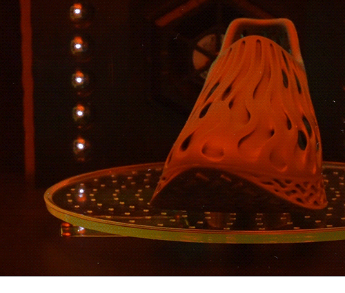 Resin 3D printed shoe model curing inside the Phrozen Curing Station with 405 nm UV light for even curing.