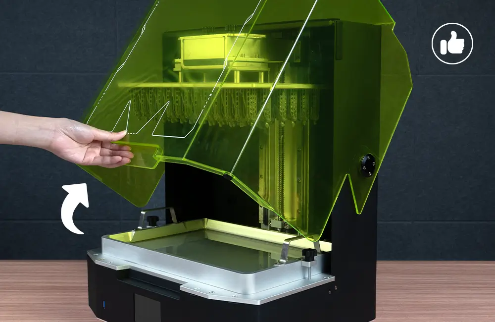 Hand opening the lift-up lid on the Phrozen Sonic Mega 8K S for easier print access.