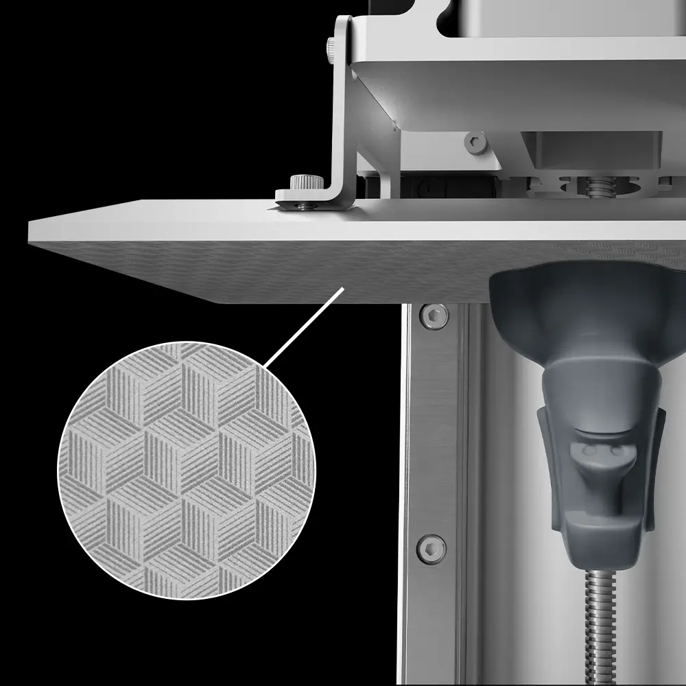 Close-up of the Phrozen Sonic Mini 8K frosted laser-cut build plate, highlighting its textured surface for improved print adhesion.