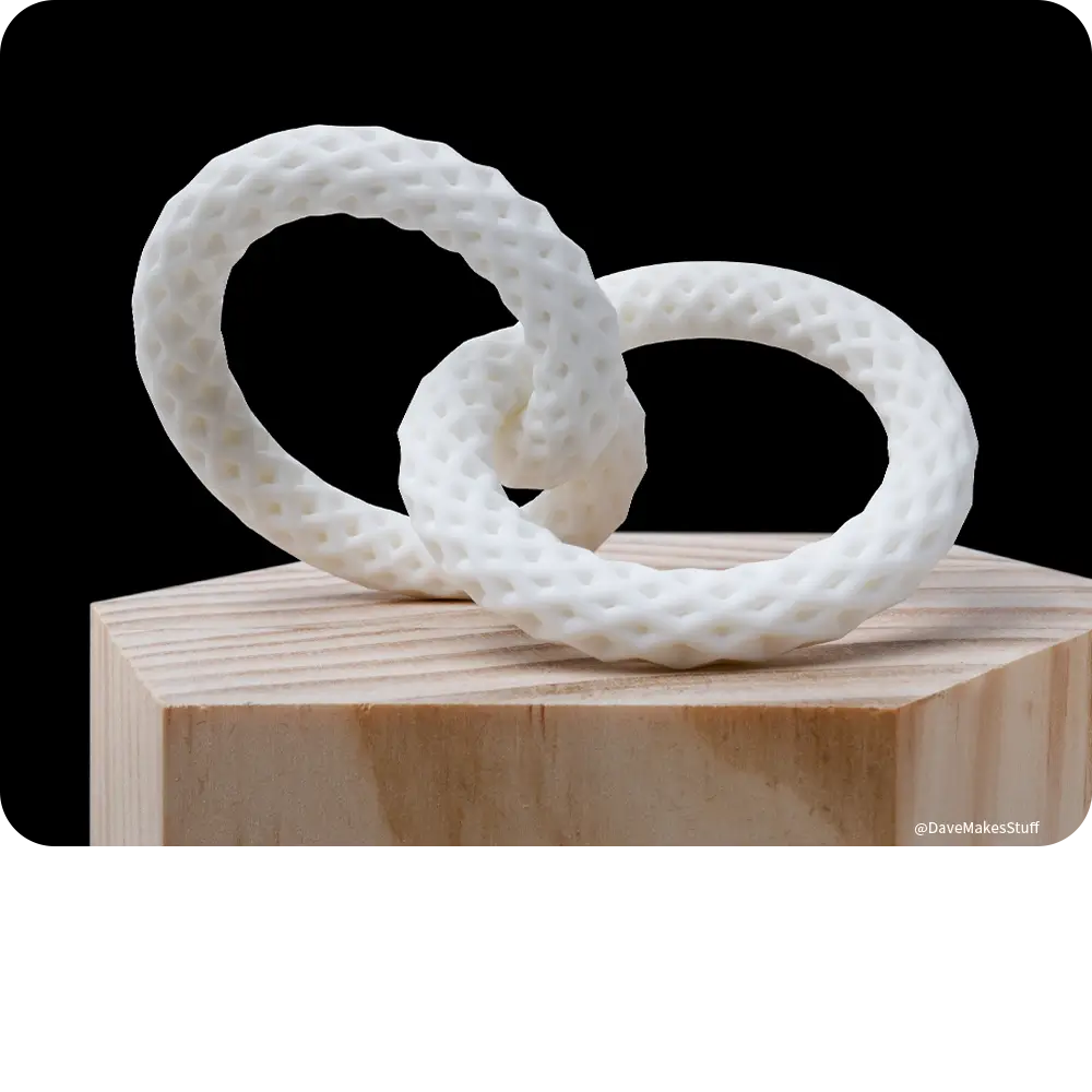 Two white textured ring models printed with Phrozen Ceramic White Resin for elegant decorative design concepts.