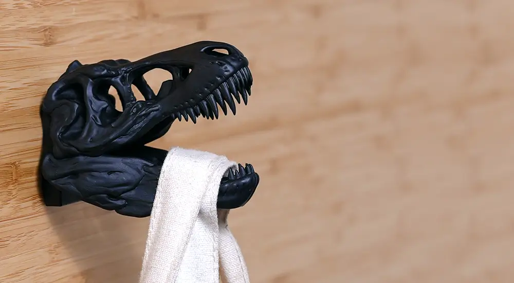 Dinosaur head wall hook printed with Phrozen x Loctite ONYX Rigid Pro410, highlighting high holding strength for DIY use.