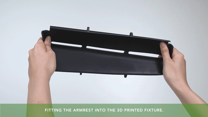 GIF of hands twisting a 3D printed armrest made with Phrozen Tough 100E resin, showing toughness and flexibility.