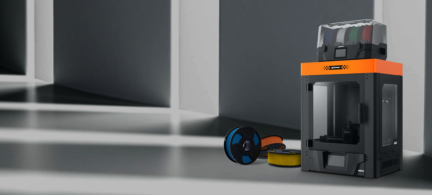Background image of the Phrozen ARCO FDM printer with Pentashield, Chroma Kit, and filaments.